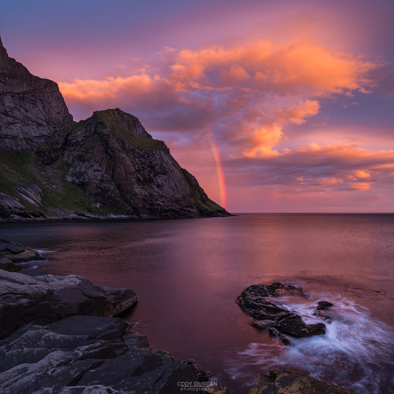 Rainbow at Sunrise over mountains from Bunes Beach, Moskenesoy, Lofoten Islands, Norway