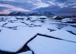 Frozen sea ice along winter coastline, near Nedredal, Vestvågøy, Lofoten Islands, Norway
