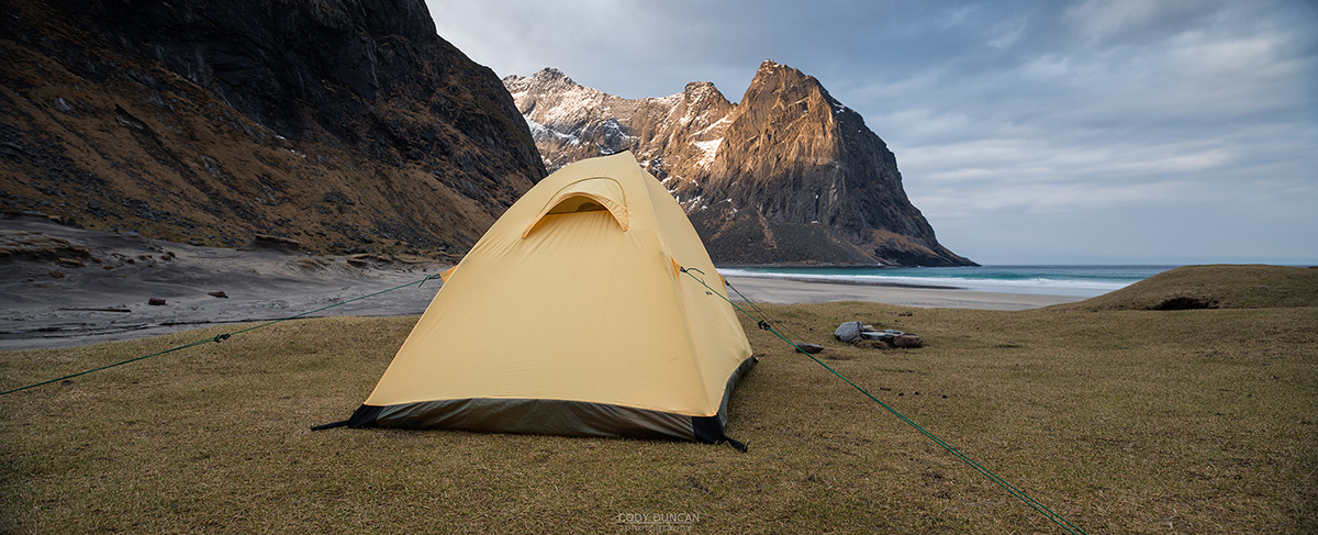 Wild tent camping at scenic Kvalvika beach, Moskenesøy, Lofoten Islands, Norway