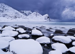Winter storm over snow covered beach, Unstad, Lofoten islands, Norway