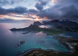 MIdnight sun view over coastal landscape from summit of Offersøykammen mountain peak, Vestvågøy, Lofoten Islands, Norway