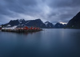 Red fishermen's Rorbu cabins over fjord, Hamnøy, Reine, Moskenesøy, Lofoten Islands, Norway