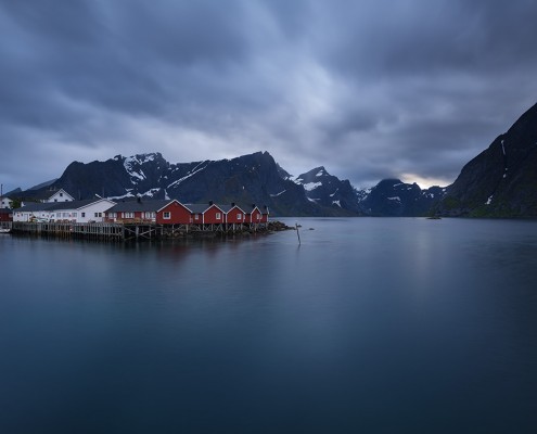 Red fishermen's Rorbu cabins over fjord, Hamnøy, Reine, Moskenesøy, Lofoten Islands, Norway