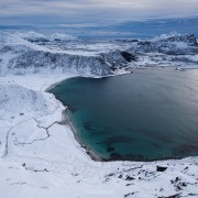Winter view over snow covered Haukland and Vik beaches from summit of Mannen, Vestvågøy, Lofoten Islands, Norway