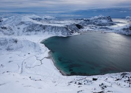 Winter view over snow covered Haukland and Vik beaches from summit of Mannen, Vestvågøy, Lofoten Islands, Norway