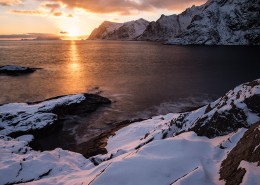 Winter sunser over snow covered coast at Å, Moskenesøy, Lofoten Islands, Norway