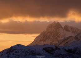 Winter sunrise over Solbjørn mountain peak, Moskenesøy, Lofoten Islands, Norway