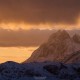 Winter sunrise over Solbjørn mountain peak, Moskenesøy, Lofoten Islands, Norway