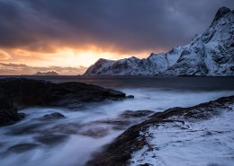 Winter sunser over snow covered coast at Å, Moskenesøy, Lofoten Islands, Norway