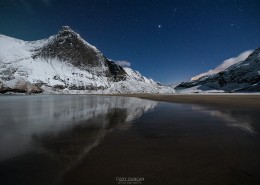 Night winter mountain reflection on Bunes beach, Moskenesøy, Lofoten Islands, Norway