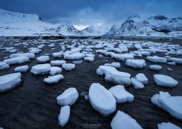 Lofoten Islands, Norway: Remaining snow at low tide in Flakstadpollen. Friday Photo #212 - 68 North. Lofoten Islands Photography and Travel
